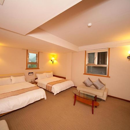 Tian Long Hotel Csiaohszi Kültér fotó
